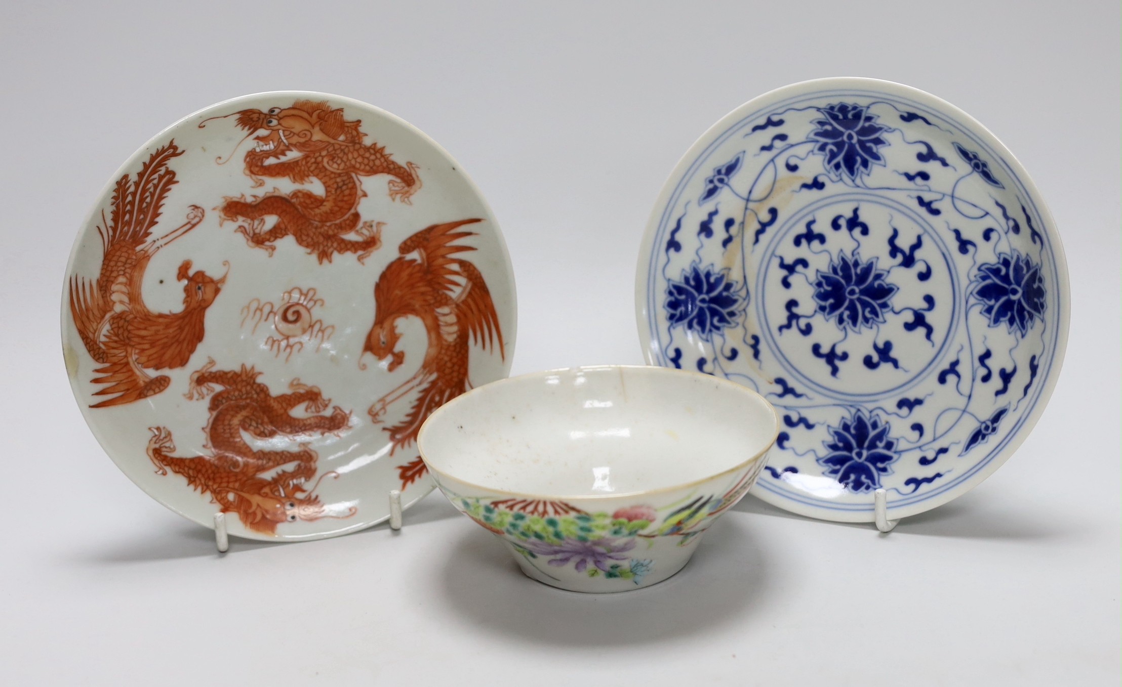 A Chinese blue and white saucer, together with a ‘dragon and phoenix’ saucer and a famille rose bowl